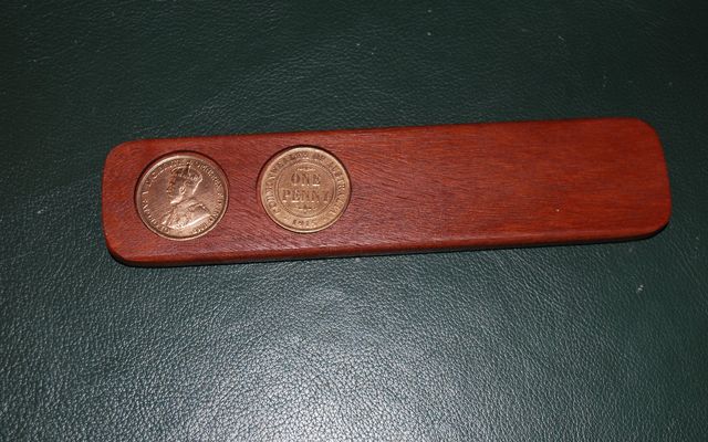 Two-up kip with two pennies